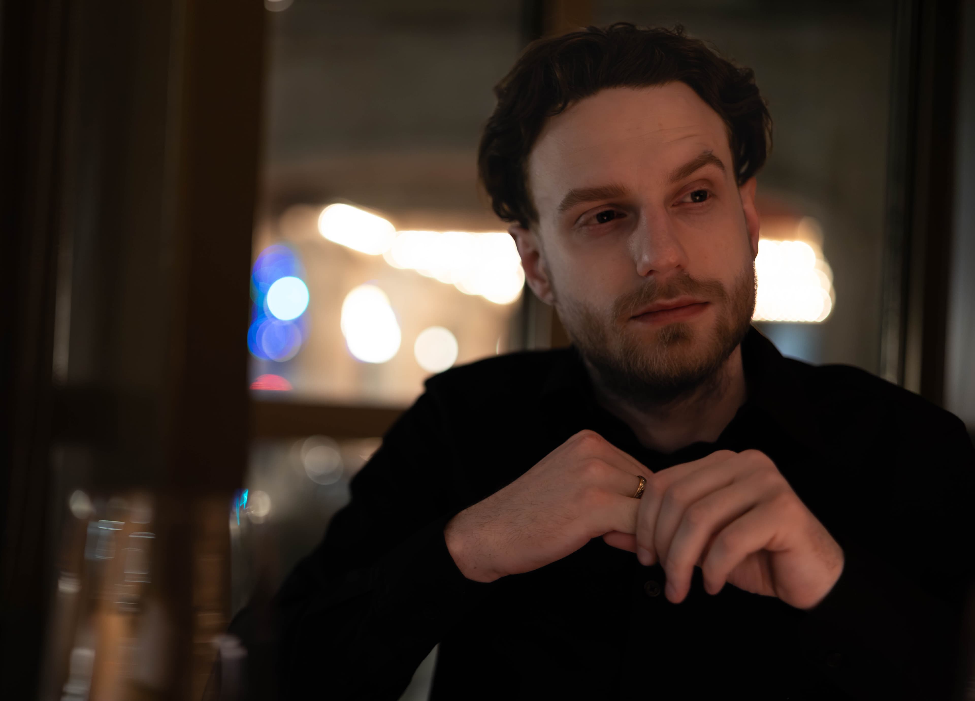 Man seated at restaurant with cinematic lighting