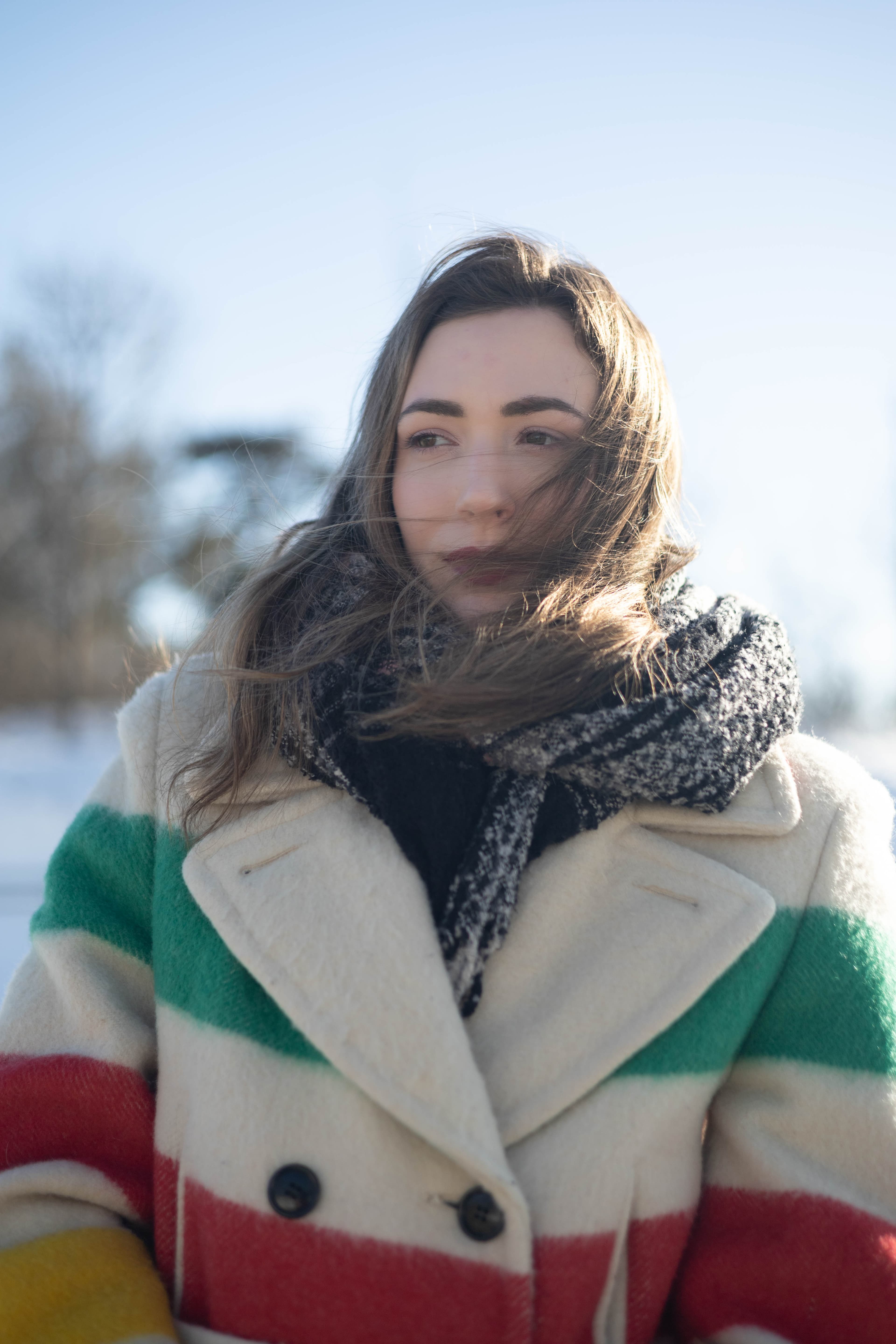 Closeup of woman with hair blowing in the wind